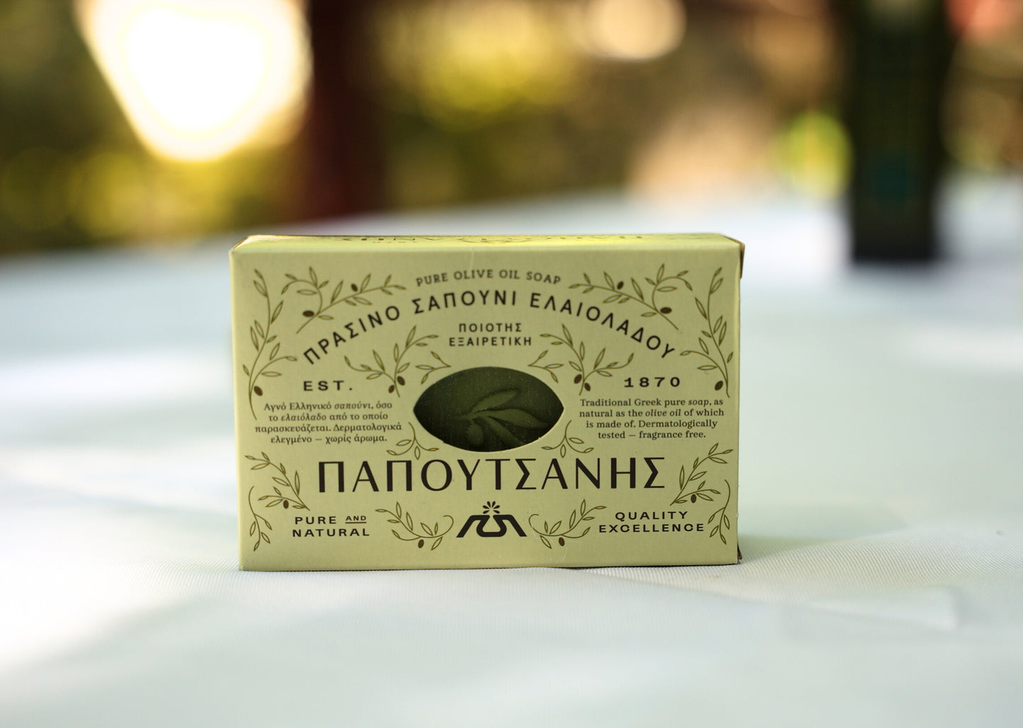 Close-up of olive oil soap on a table with package 