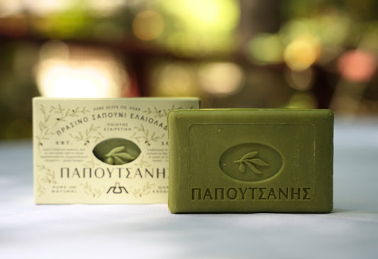 Close-up of olive oil soap on a table, highlighting its smooth surface and gentle, moisturizing properties.